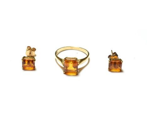 A citrine ring, stamped '9K', finger size Q1/2; and a pair of matching earrings, unmarked .  The pieces are in good condition