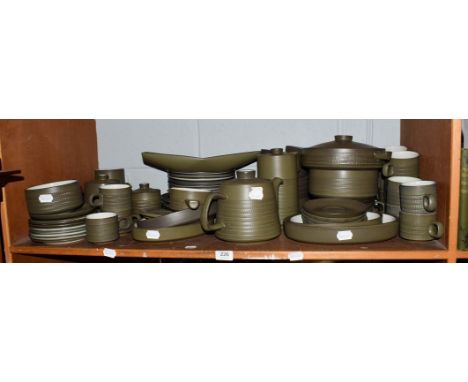 A large collection of Denby Stoneware dinner and tea wares, green ground (one shelf)