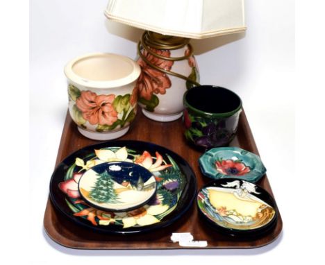 Eight items of modern Moorcroft including lamps and dishes (8).  No chips, cracks or repair. Some crazing. The wiring on the 