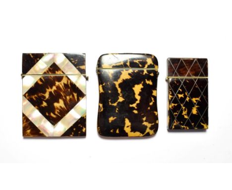 Three tortoiseshell card cases inlaid with mother of pearl.  The body of the largest has been squeezed together. Some other s