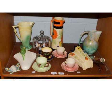 A group of Deco and Deco style ceramics including Arthur Wood wall pocket, Royal Couldon jug and a group of silver (on one sh