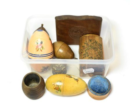 A collection of treen comprising two pears, two eggs - one with needlework items, an early straw work box, an enamel box, a p