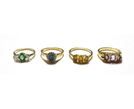 A 9 carat gold amethyst and diamond ring, finger size S; and three further 9 carat gold gem set rings, various designs and fi