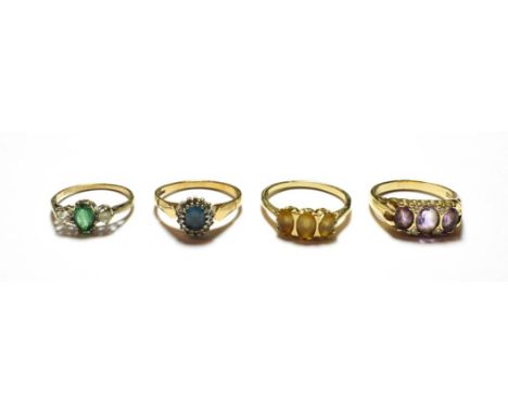 A 9 carat gold amethyst and diamond ring, finger size S; and three further 9 carat gold gem set rings, various designs and fi