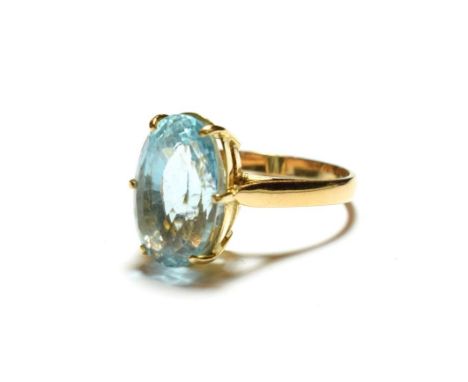 A blue topaz ring, stamped '9K', finger size Q.  Gross weight 5.3 grams. 