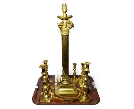 A brass Corinthian column table lamp, together with some brass candle sticks (qty)