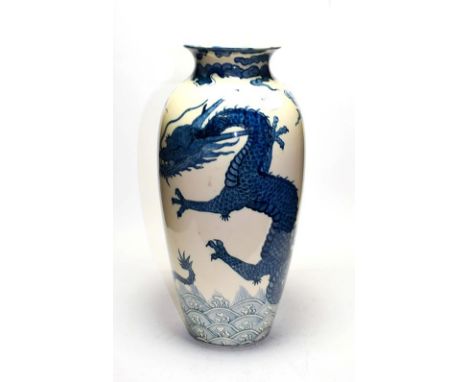 A Mintons Art Pottery studio pottery vase decorated with a three claw dragon, height 36.5cm.  Four pieces re glued to the rim