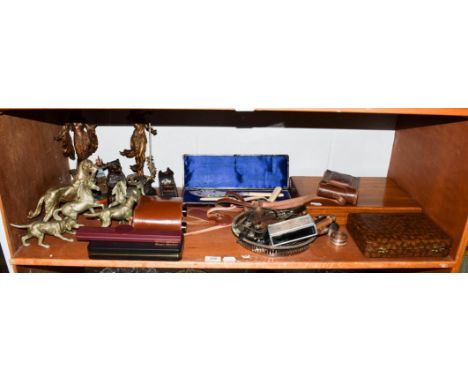 A shelf including a Manoah Rhodes &amp; Son Ltd cased fish knives and forks, two other plated cased sets, base metal animal f