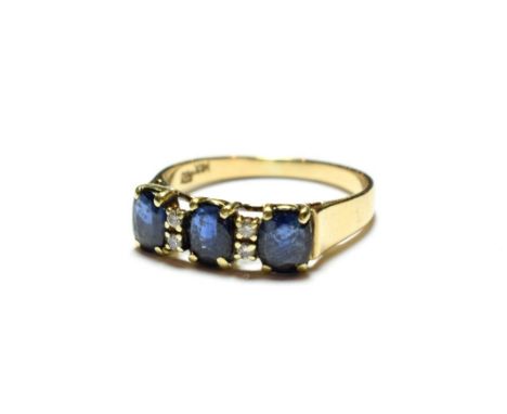 A sapphire and diamond ring, stamped '585' and '14K', finger size Q1/2.  Gross weight 3.0 grams. 