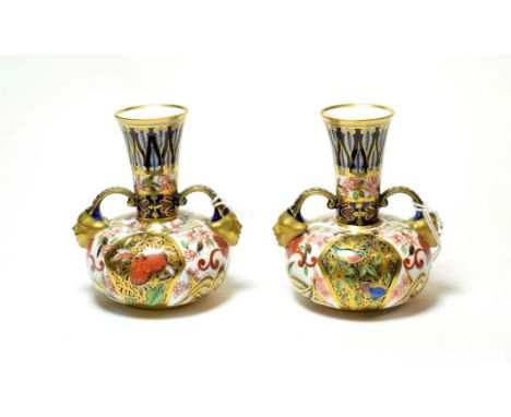 A pair of Royal Crown Derby Imari pattern twin handled vases (2).  No damage or repair. Some light gilt wear to the mask term