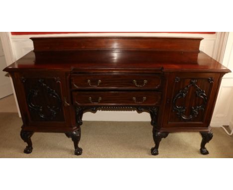 An Edwardian Chippendale style mahogany Sideboard, of inverted breakfront outline, and two centre drawers flanked to either s
