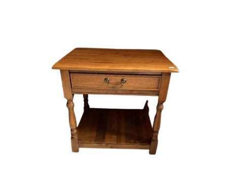 A good rectangular oak Side or Occasional Table, with frieze drawer on turned supports and a stretcher shelf, 59cms x 61cms (