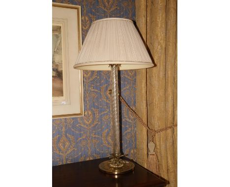 A heavy brass mounted tall Table Lamp, with spiral reeded glass stem on circular base with sprouting leaves, cream pleated sh