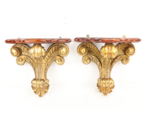 A good pair of mahogany and parcel gilt Wall Brackets, with serpentine shaped moulded shelf supported by an ornate Prince of 