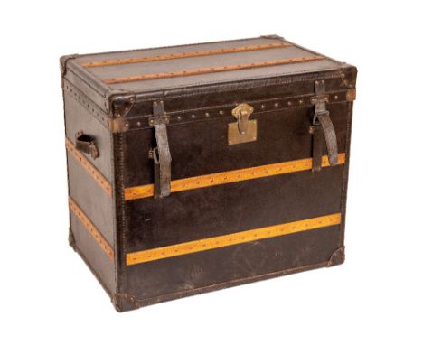 A very large leather and wooden bound Steamer Trunk, with brass studs and two leather carrying handles, padded interior and b