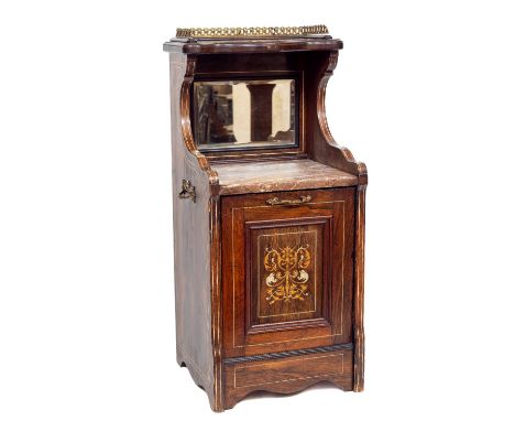 An Edwardian inlaid mahogany Purdonium, the serpentine shaped top shelf with a three quarter pierced brass gallery with reces