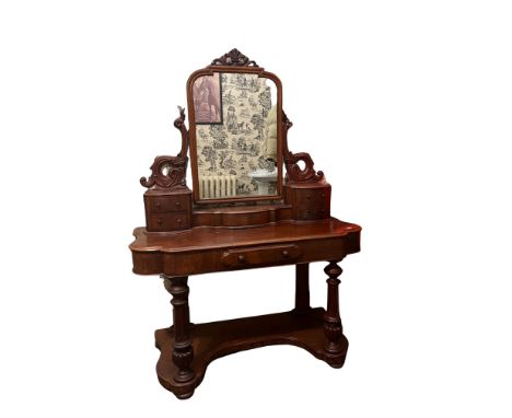 A Victorian mahogany Duchess Dressing Table, with swing frame mirror above two pairs of drawers and hinged shelf, and a friez