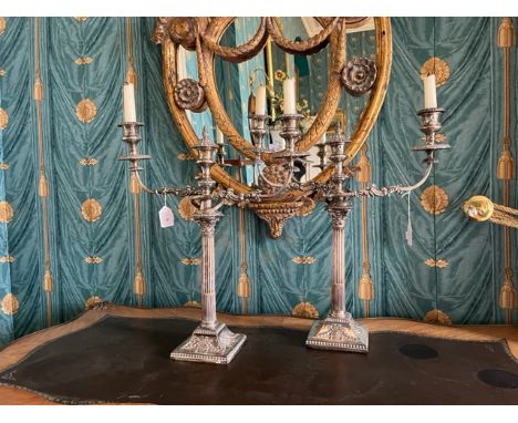 A pair of Adams style silver plated Candlesticks, each with half reeded and fluted column and Corinthian capital on flared sq