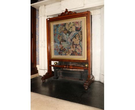 A Victorian mahogany cheval Firescreen, with tapestry panel depicting a dove above a turned stretcher on four bun feet, appro