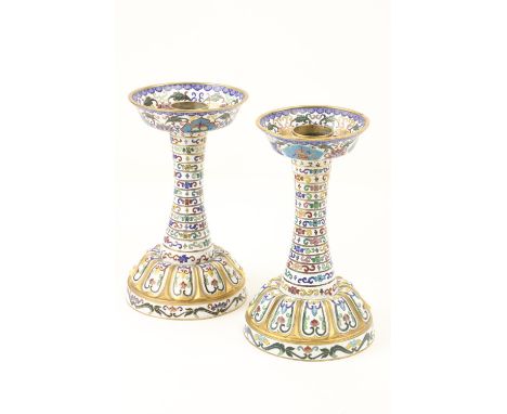 A pair of very unusual Chinese polychrome cloisonn‚ enamel Candlesticks, each with a 15 band stem supporting a bowl top on do