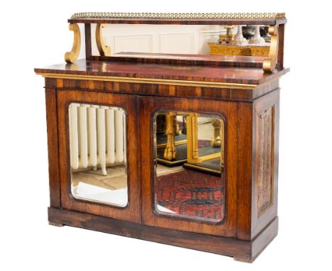 A good late Regency rosewood Chiffonier, with pierced brass gallery on a shelf with mirror panel supported by gilt 'C' scroll