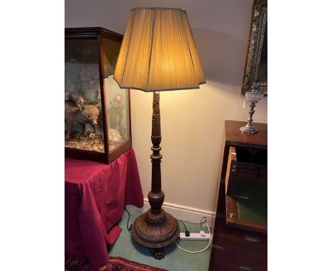 A very attractive Chippendale style mahogany Standard Lamp, with three stage stem carved with leaves and floral garlands, low