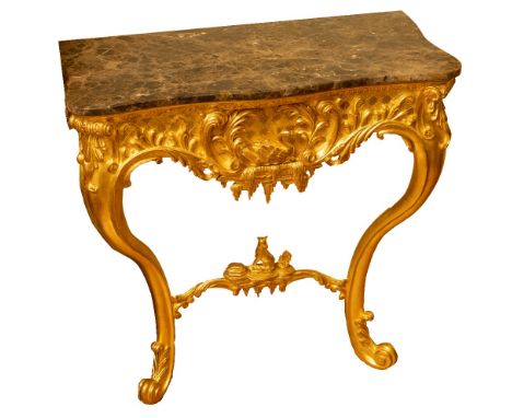 An exceptional pair of finely carved giltwood Console Tables, in the George III - Thomas Chippendale manner, each with a marb