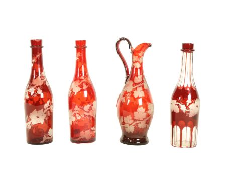 A very good late 19th Century Bohemian vine engraved ruby glass Claret Jug, 31cms (12"); together with three similar Bohemian