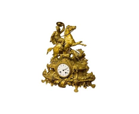 A 19th Century brass and ormolu French Mantle Clock, stamped on verso P.H. Mourey, surmounted with man on horseback in pursui