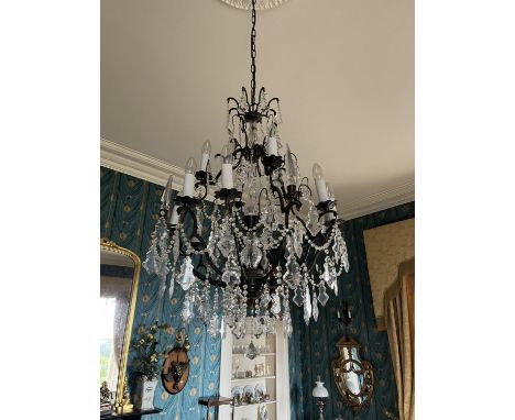 A fine brass and glass French style two tier Chandelier, with four arms above eight arms below, some with obelisk finial and 