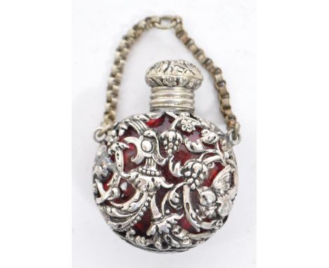 19th century Chinese Tibetan scent / snuff bottle flask. With pierced body decoration with carry holding chain with red glass