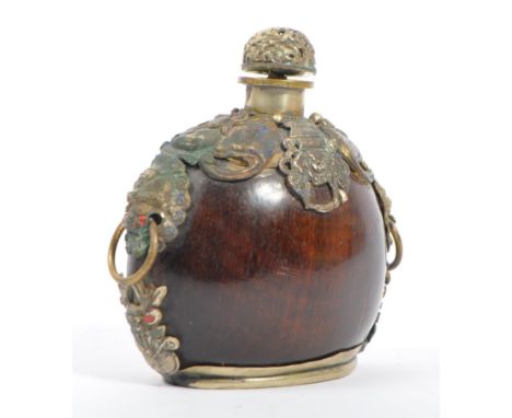 A late 19th / early 20th Century Chinese silver / white metal opium snuff / scent perfume bottle of flask shape with silver e