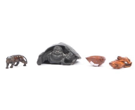 A collection of late 20th century Japanese Netsuke carved wood figures. Comprising of a frog riding a fish, a crab in half wa