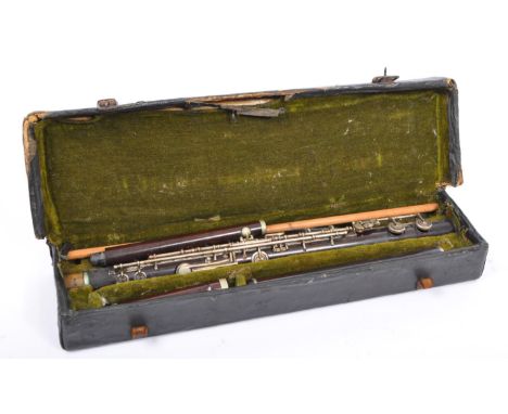 MUSICAL INSTRUMENTS: A mid 20th century cased 'John Grey &amp; Sons' Clarinet. Complete with the original green lined carry c