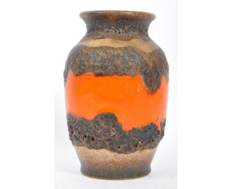 A mid 20th century West German lava ceramic pottery vase. With a flared lipped circular top, tapering body on a circular base