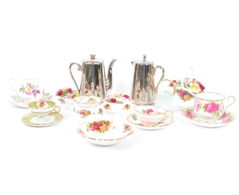 A collection of mid 20th century decorative porcelain china cups, saucers, flower baskets with coffee / water Pot. The lot co