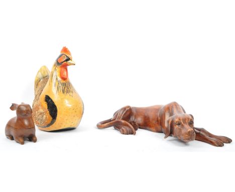 A collection of 20th century carved Treen type creatures to include a large Vizsla Dog (Hungarian gundog) lying down and smal
