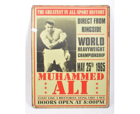 A vintage mid 20th century advertising enamel wall sign. Depicting Muhammed Ali advertising the World heavyweight championshi