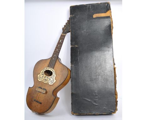 An early 20th century lyre shaped Viennese flat back&nbsp;music string instrument mandolin. Having four strings, could be eig