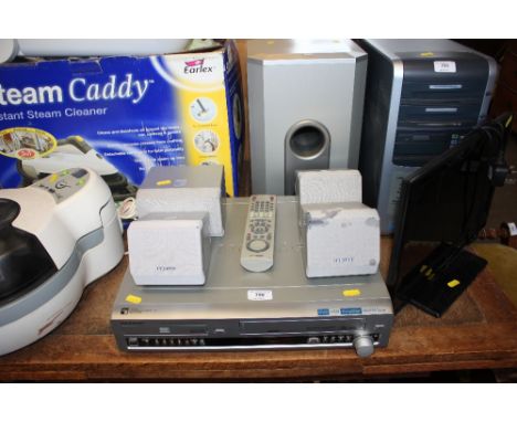 A Samsung DVD and VHS player together with a surround sound system 