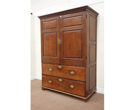 Oak Linen Press the moulded dentil cornice over panelled doors, two moulded long drawers raised on bracket feet, W141cm, H198