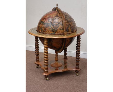 Reproduction floor standing globe drinks cabinet, hinged top revealing revolving drinks compartment, raised on turned support