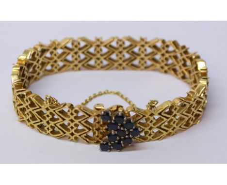 Gold heart shaped gate bracelet set with ten sapphires tested to 18ct approx 42.7gm Condition Report Click here for further i