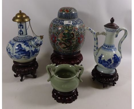 Chinese ginger jar, two Chinese blue and white wine decanters and a celadon bowl Condition Report Ginger jar - crazing throug