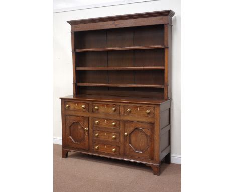Mid 19th century oak dresser fitted with six drawers and two cupboards, raised three tier plate rack, inlays to frieze, raise