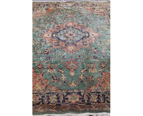 Persian emerald green and peach ground rug carpet, 360cm x 276cm Condition Report Click here for further images, condition, a