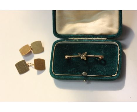 A pair of 9ct gold rectangular engine turned cuff links 5.5g, and a bar brooch decorated with a pearl inset insect 