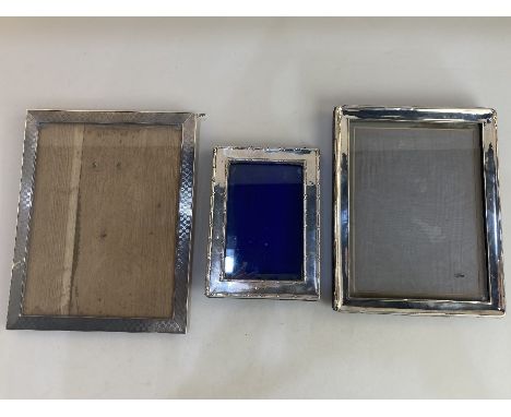 A George V silver photograph frame, makers William Neale &amp; Son Ltd, Birmingham 1927, 16.5cm by 22cm aperture, another wit