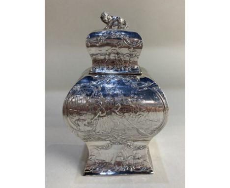 A 19th century Dutch silver bombe tea caddy, with embossed waterside and countryside scenes, 1872, with British import mark, 