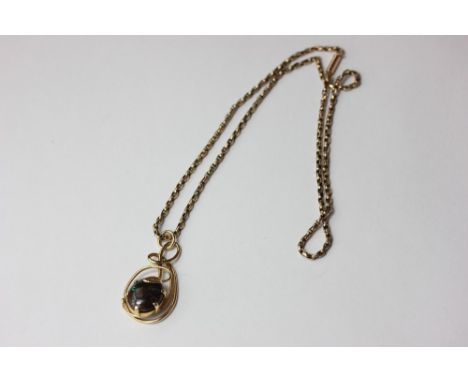 An opal pendant on a box link chain with baton clasp